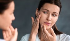 sebium_maskne-women-checking-acne-mirror